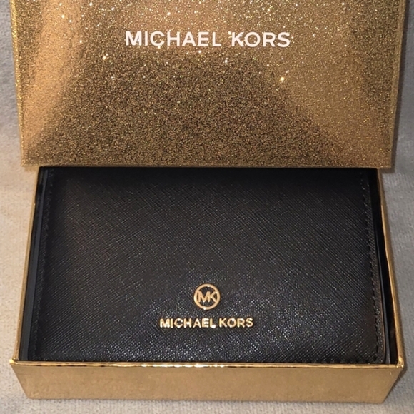 Michael Kors Handbags - Michael Kors medium slim black leather wallet with gift box.